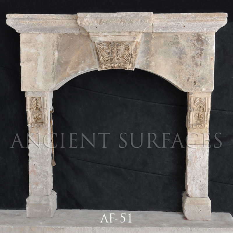 Antique reclaimed stone fireplace mantle from Malta with an English influence