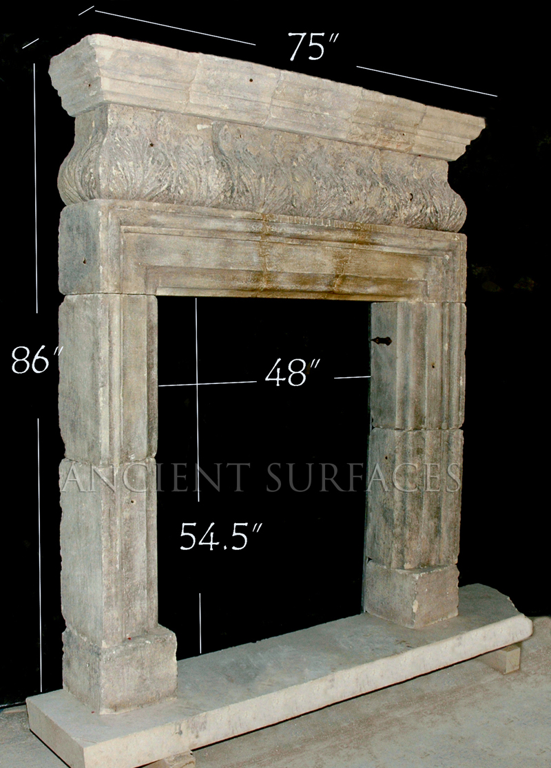 Antique reclaimed English fireplace mantle carved out of stone