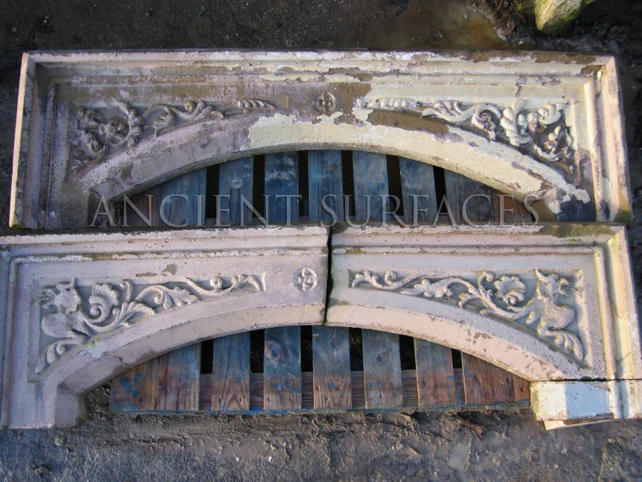 Two Tudor antique reclaimed mantel tops sitting in our salvage yard