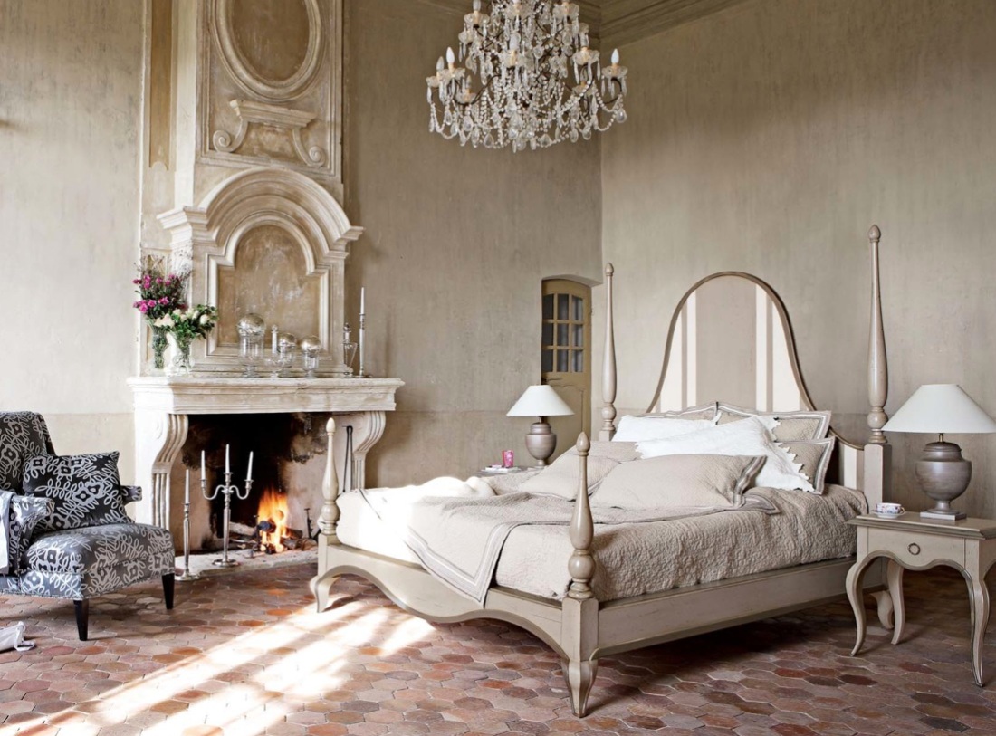 Glamorous bedroom ornate fireplace