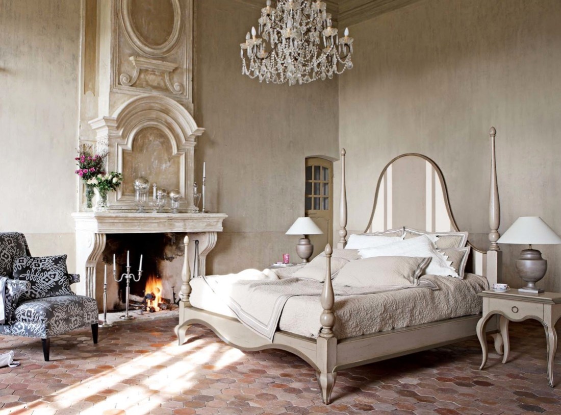 Glamorous bedroom ornate fireplace