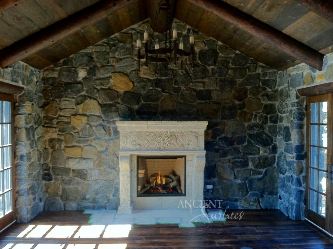 Antique Reclaimed 12th century Limestone Fireplace in its final home in Colorado.