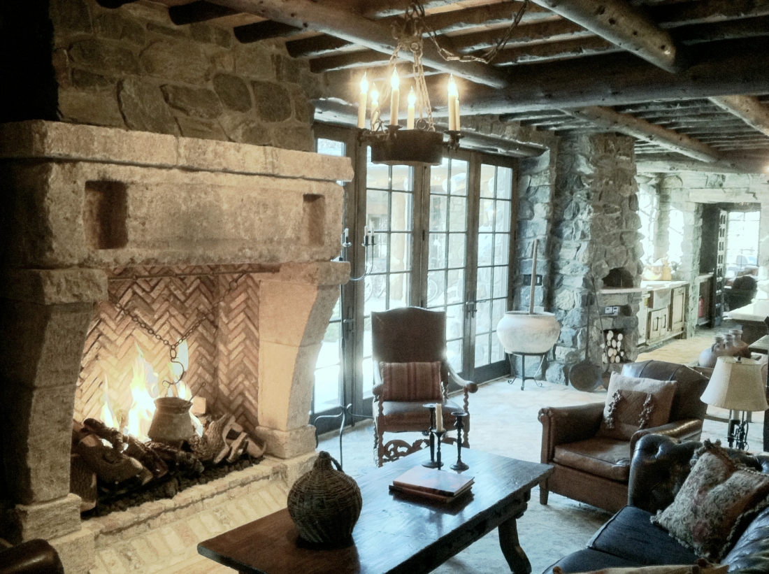 A 12th Century antique Stone fireplace salvaged from the South of France and installed in a Colorado compound.