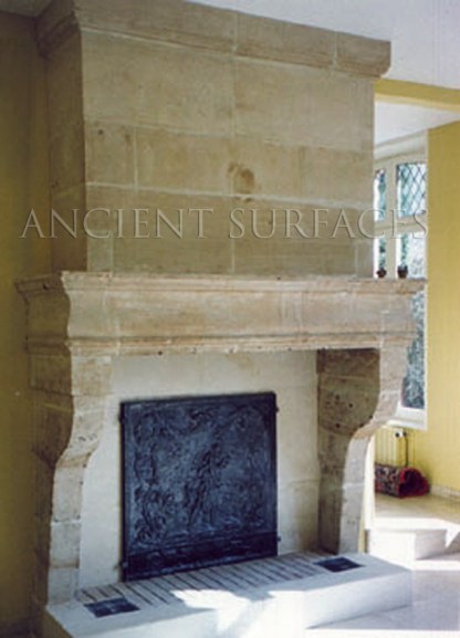 A reclaimed 18th century French Fireplace Mantle from Burgundy. Reclaimed by Ancient Surfaces sold by dealer to current owner.