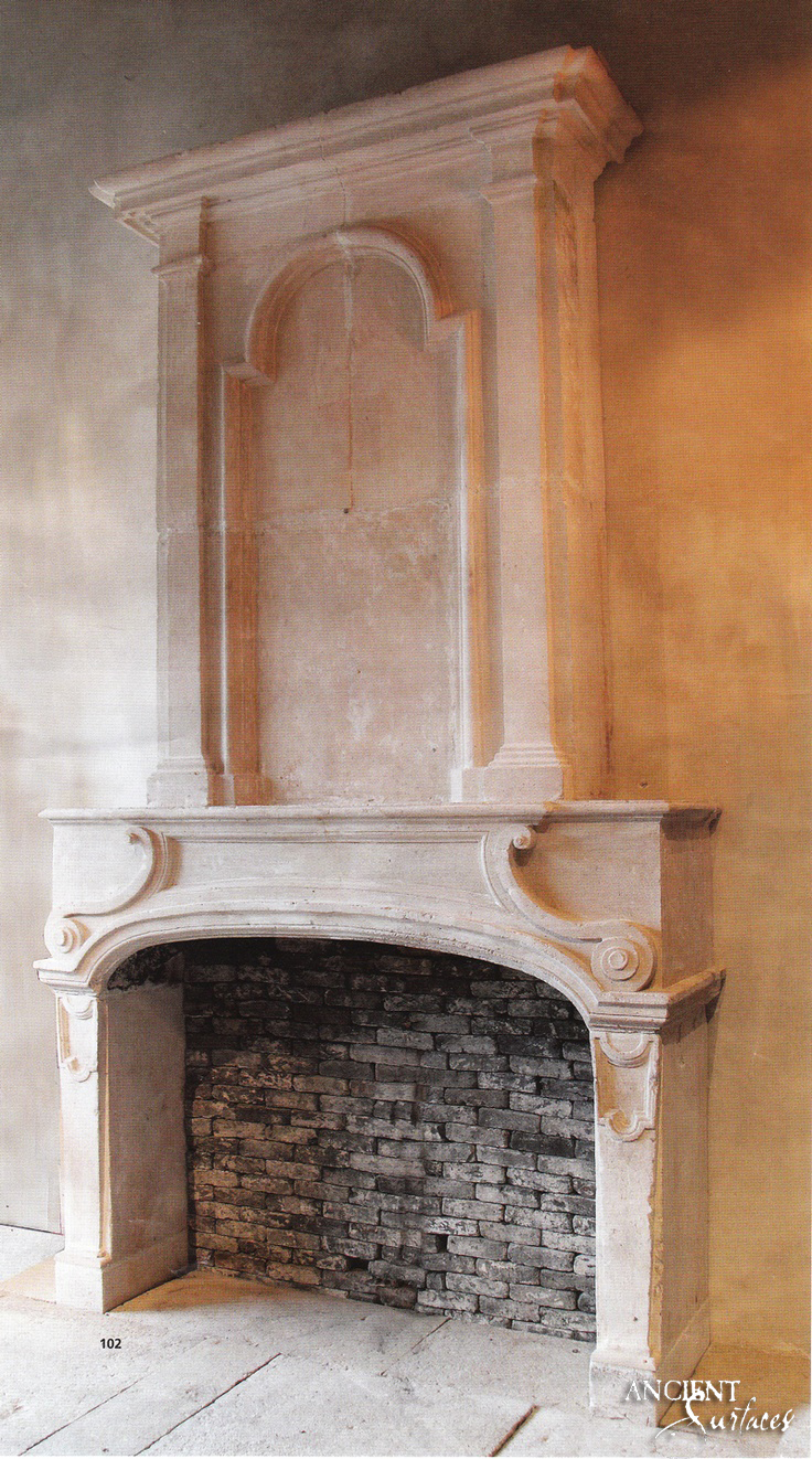 Antique-limestone-fireplace-over-mantel