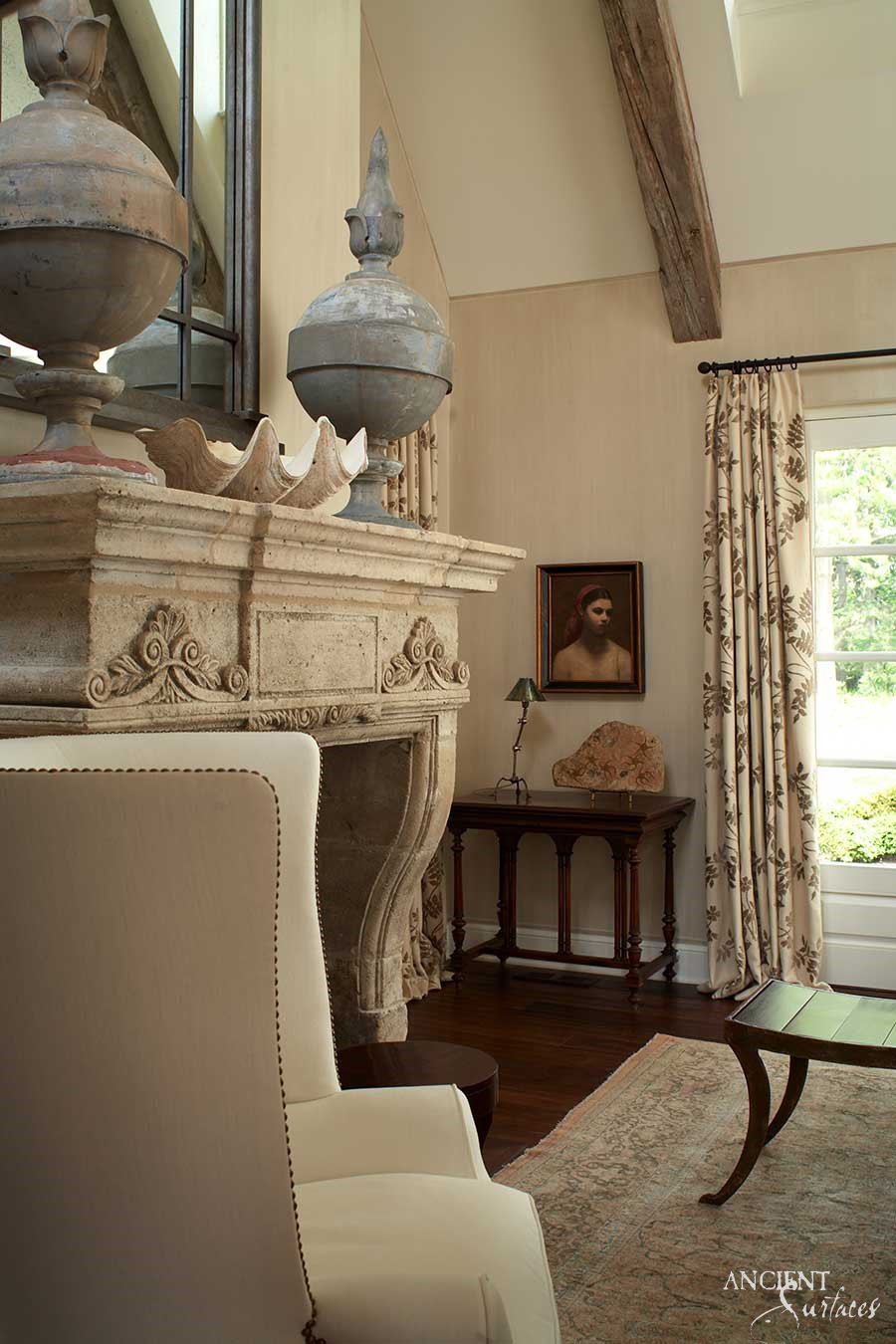 This limestone fireplace is the focal point of this small cottage living room