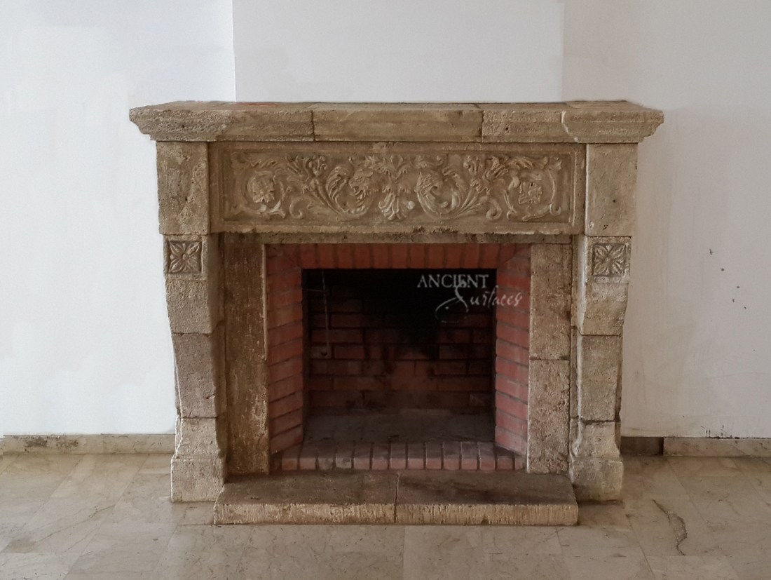 heavy carved limestone fireplace