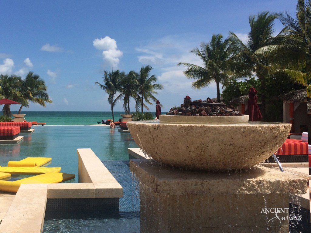 Handcrafted limestone fire pit by Ancient Surfaces, a testament to the company's dedication to quality and authenticity.