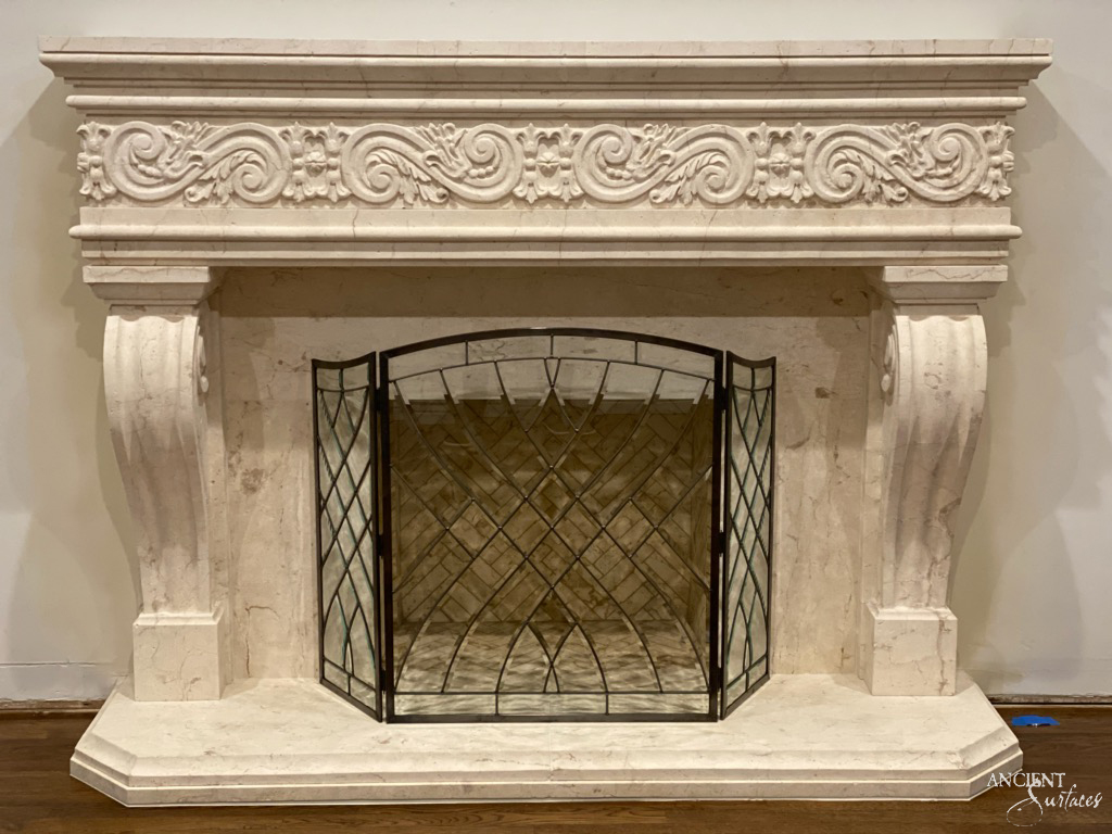 The intimate warmth of an indoor fireplace, its ancient stones surrounding a modern firebox, offering a serene spot for relaxation and reflection.