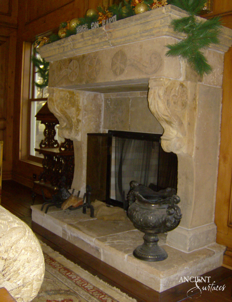 The intimate warmth of an indoor fireplace, its ancient stones surrounding a modern firebox, offering a serene spot for relaxation and reflection.